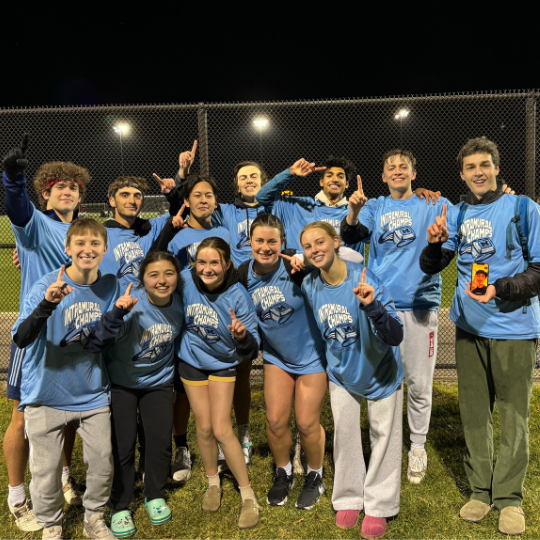 Co-ed soccer team posing for photo